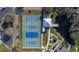 Aerial shot of community pickleball courts with shaded seating area, offering a fun outdoor activity at 2002 Australia E Way # 66, Clearwater, FL 33763