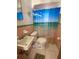 Cozy bathroom featuring pink tile and bright shower curtain at 2100 Pass A Grille Way, St Pete Beach, FL 33706