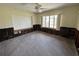 A bedroom featuring an old ceiling fan, windows and damaged drywall at 2100 Pass A Grille Way, St Pete Beach, FL 33706