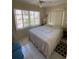 Sunlit bedroom with large window and ceiling fan at 2100 Pass A Grille Way, St Pete Beach, FL 33706