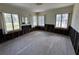 Bedroom featuring hardwood floors, multiple windows, and damaged drywall at 2100 Pass A Grille Way, St Pete Beach, FL 33706