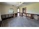 A bedroom featuring an old ceiling fan, closet, windows and damaged drywall at 2100 Pass A Grille Way, St Pete Beach, FL 33706