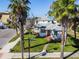 Charming home with well-maintained lawn, palm trees, and a welcoming facade in a sunny neighborhood at 2100 Pass A Grille Way, St Pete Beach, FL 33706