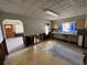 A kitchen features outdated cabinets and fixtures, and damaged walls at 2100 Pass A Grille Way, St Pete Beach, FL 33706