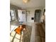 Inviting living area with tile flooring, comfy sofa, and access to kitchen and exterior, perfect for relaxing at 2100 Pass A Grille Way, St Pete Beach, FL 33706