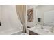 Bright bathroom featuring a shower-tub combo with a neutral color scheme, perfect for a relaxing bath experience at 2286 Sienna Spruce St, Wesley Chapel, FL 33543