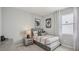 Cozy bedroom features a comfortable twin bed, neutral decor, and a stylish nightstand with modern accents at 2286 Sienna Spruce St, Wesley Chapel, FL 33543