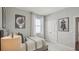 This bedroom features a bed with art and a closet, creating a modern and efficient living space at 2286 Sienna Spruce St, Wesley Chapel, FL 33543