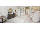 Beautiful bedroom featuring an ensuite bathroom, soothing paint colors, and a decorative dresser at 2286 Sienna Spruce St, Wesley Chapel, FL 33543