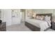 Spacious bedroom features decor art, neutral colors, and plush carpeting at 2286 Sienna Spruce St, Wesley Chapel, FL 33543