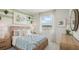 Cozy bedroom with a plush bed, natural light, and stylish decor at 2286 Sienna Spruce St, Wesley Chapel, FL 33543