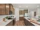 Spacious kitchen with stainless steel appliances, white countertops, and wood cabinets at 2286 Sienna Spruce St, Wesley Chapel, FL 33543