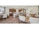 Open-concept living and kitchen area with stainless steel appliances and modern decor at 2286 Sienna Spruce St, Wesley Chapel, FL 33543