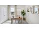 Bright home office featuring a rustic desk, an accent chair, and lots of natural light at 2286 Sienna Spruce St, Wesley Chapel, FL 33543