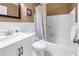 Bright bathroom featuring a tub and shower combo, along with a vanity at 2452 Brazilia Dr # 18, Clearwater, FL 33763