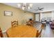 Well-lit dining area with a round table and an adjacent living area at 2452 Brazilia Dr # 18, Clearwater, FL 33763