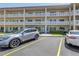 Well-maintained complex with multiple units, parking spots, and manicured landscaping at 2452 Brazilia Dr # 18, Clearwater, FL 33763