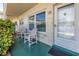 Inviting front porch with cozy seating and a view of the neighborhood at 2452 Brazilia Dr # 18, Clearwater, FL 33763