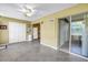 This kitchen features white appliances and tile floors with natural light at 2452 Brazilia Dr # 18, Clearwater, FL 33763
