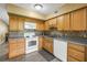 Open kitchen showcasing modern appliances, ample cabinetry, tile backsplash and lots of natural light at 2452 Brazilia Dr # 18, Clearwater, FL 33763