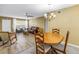 Open concept living space with dining and living areas with natural light at 2452 Brazilia Dr # 18, Clearwater, FL 33763