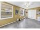 Inviting living area with tile flooring, neutral walls, a ceiling fan, and view of the outdoors at 2452 Brazilia Dr # 18, Clearwater, FL 33763