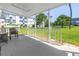 Covered patio overlooking a meticulously landscaped lawn and neighborhood at 2452 Brazilia Dr # 18, Clearwater, FL 33763
