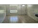 Bright living room with tile flooring and a large window at 2603 Mary Sue Sw St, Largo, FL 33774