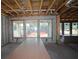 Interior of new construction home with exposed framing, windows, and concrete block walls at 3108 W Varn Ave, Tampa, FL 33611