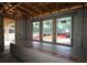 Interior of new construction home with exposed framing, windows, and concrete block walls at 3108 W Varn Ave, Tampa, FL 33611