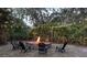 Inviting backyard with a fire pit surrounded by chairs, perfect for outdoor gatherings at 314 Bloomingfield Dr, Brandon, FL 33511