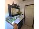 Bathroom featuring a vanity with a sink, decorative flowers and a white door at 314 Bloomingfield Dr, Brandon, FL 33511