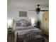 Bedroom featuring a bed with decorative pillows, side tables, lamps, and an antique dresser at 314 Bloomingfield Dr, Brandon, FL 33511