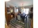 Bright dining room with a modern chandelier, table for six, and access to the kitchen at 314 Bloomingfield Dr, Brandon, FL 33511