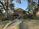 Inviting two-story home featuring a landscaped yard, brick walkway, and a charming front porch at 314 Bloomingfield Dr, Brandon, FL 33511