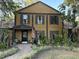 Inviting two-story home featuring a landscaped yard, brick walkway, and a charming front porch at 314 Bloomingfield Dr, Brandon, FL 33511