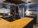 Modern kitchen with butcher block counters, stainless appliances, and stylish tile accents at 314 Bloomingfield Dr, Brandon, FL 33511