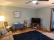 Cozy living area with a table, chairs, TV, and plush rug, offering a versatile space for relaxation and entertainment at 314 Bloomingfield Dr, Brandon, FL 33511