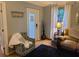 Comfortable living area with an armchair, couch, window, and door, designed to create a relaxing and functional space at 314 Bloomingfield Dr, Brandon, FL 33511