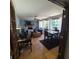 Bright and spacious living area with a brick fireplace, large windows, and tile flooring at 314 Bloomingfield Dr, Brandon, FL 33511