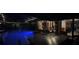 Backyard pool with outdoor seating and string lights creating a relaxing ambiance at night at 314 Bloomingfield Dr, Brandon, FL 33511