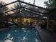 Relaxing screened-in pool area with comfortable seating, perfect for outdoor entertaining at 314 Bloomingfield Dr, Brandon, FL 33511