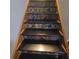 Close up of staircase featuring colorful tile on risers with wooden banister on side at 314 Bloomingfield Dr, Brandon, FL 33511