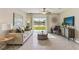 Bright living room featuring backyard lake views, neutral furnishings, and stylish decor at 32690 Winterwood Boulevard Blvd, Wesley Chapel, FL 33543