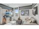 Stylish bedroom featuring unique movie themed decor, including posters, and sleek gray accents for a modern feel at 32702 Winterwood Blvd, Wesley Chapel, FL 33543