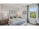 Bedroom features a large window and matching nightstands at 32702 Winterwood Boulevard Blvd, Wesley Chapel, FL 33543