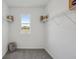 Empty walk-in closet with plenty of storage space at 32702 Winterwood Boulevard Blvd, Wesley Chapel, FL 33543
