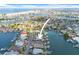 Spectacular aerial view of waterfront property with canal access and bay views at 5 Marina Ter, Treasure Island, FL 33706