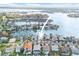 Beautiful aerial view of waterfront home with private boat dock on a canal at 5 Marina Ter, Treasure Island, FL 33706