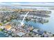 Gorgeous aerial view of waterfront property and neighborhood homes on canal at 5 Marina Ter, Treasure Island, FL 33706